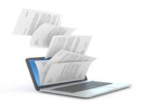 File papers being filed in computer
