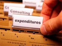 Hand opening a expenditure file folder